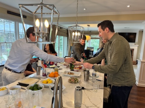 Bartender serving guests at a private indoor event