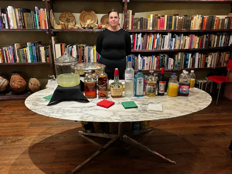 Bartender serving guests from a prepared event bar