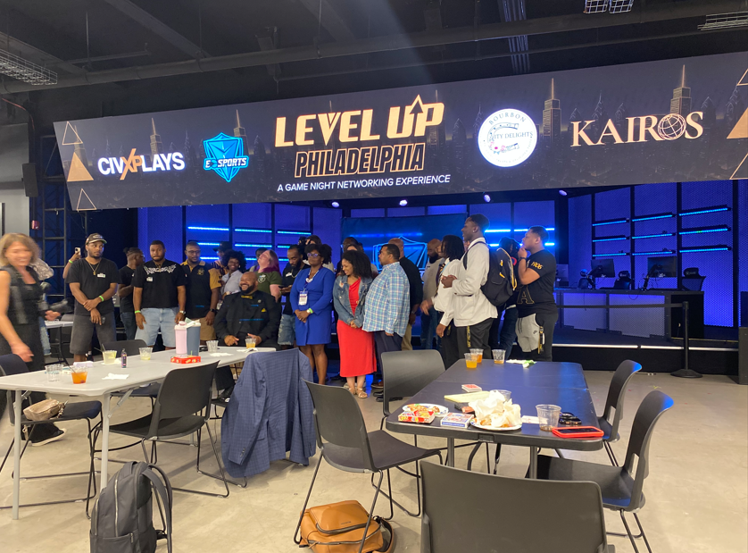 Corporate event guests gathered near a staffed bar